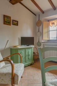 TV a/nebo společenská místnost v ubytování Casa il Castello