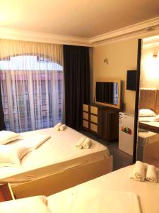 Postel nebo postele na pokoji v ubytování Hotel Aristocrat Batumi