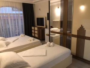 Postel nebo postele na pokoji v ubytování Hotel Aristocrat Batumi