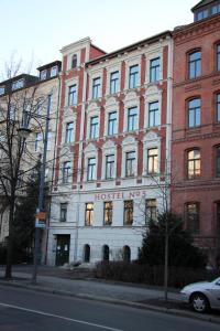 a large brick building with a hotel on it at Hostel No 5 in Halle an der Saale