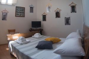 Katil atau katil-katil dalam bilik di La Casa Dei Ciottoli
