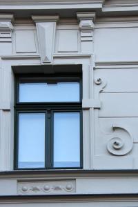 a building with two windows and a large window at Hostel No 5 in Halle an der Saale