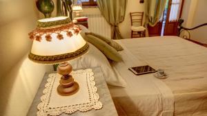 Tempat tidur dalam kamar di Cappannelle Country House Tuscany