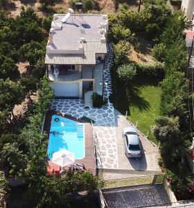 an aerial view of a house with a swimming pool at Sofia Filoxenia House in Kalyves