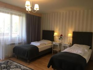 Posteľ alebo postele v izbe v ubytovaní Apartamenty w Jurgowie Świstokówka