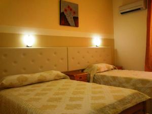 A bed or beds in a room at Summer Memories Aparthotel