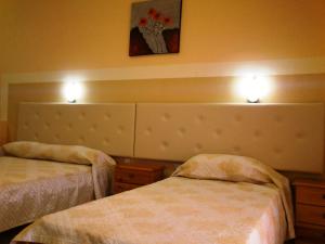 A bed or beds in a room at Summer Memories Aparthotel