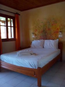 A bed or beds in a room at Pansion Matoula