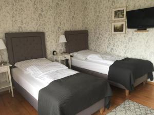 Posteľ alebo postele v izbe v ubytovaní Apartamenty w Jurgowie Świstokówka