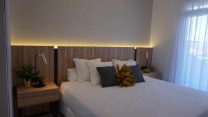 Posteľ alebo postele v izbe v ubytovaní Apartamentos La Laguna II Luxury Apartments