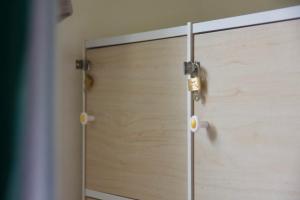 a close up of a wooden door in a room at Stay Liuqiu Diving Hostel in Xiaoliuqiu