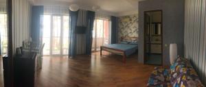 Rúm í herbergi á Guest House Guriani