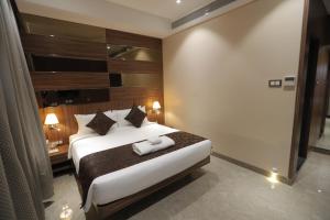 Posteľ alebo postele v izbe v ubytovaní Hotel Radiance