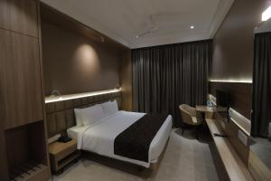 Posteľ alebo postele v izbe v ubytovaní Hotel Radiance