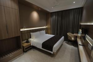 Posteľ alebo postele v izbe v ubytovaní Hotel Radiance