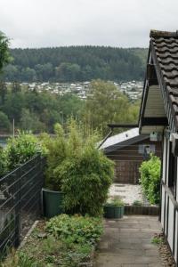 a view from the balcony of a house with plants at Ferienhaus an der Lister in Windebruch