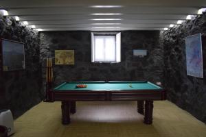 a billiard room with a pool table in it at Casa do Avô Cristiano in Madalena