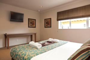 Ένα ή περισσότερα κρεβάτια σε δωμάτιο στο Beechtree Motel