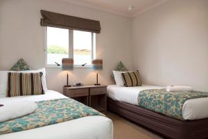 Ένα ή περισσότερα κρεβάτια σε δωμάτιο στο Beechtree Motel