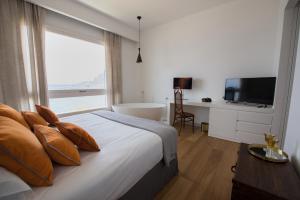מיטה או מיטות בחדר ב-Unìco Boutique Hotel d'Arte