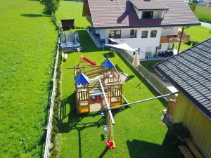 an aerial view of a house with a playground at Stiflerhof in Falzes