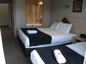 Ένα ή περισσότερα κρεβάτια σε δωμάτιο στο Beechtree Motel