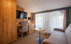 TV a/nebo společenská místnost v ubytování Sure Hotel by Best Western Wilhelmshaven City