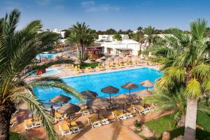 an aerial view of a resort pool with umbrellas and chairs at TUI MAGIC LIFE Penelope Beach - Families & Couples in Midoun