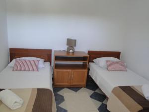 Postel nebo postele na pokoji v ubytování Mir Apartments