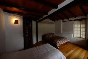 Postel nebo postele na pokoji v ubytování Sierra Alisos Hotel de Campo
