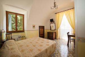 En eller flere senge i et værelse på Hotel L'Argine Fiorito