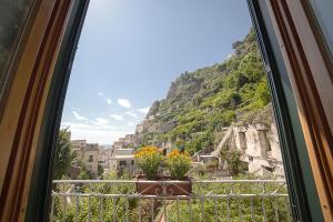 a window with a view of a mountain at Hotel L'Argine Fiorito in Atrani