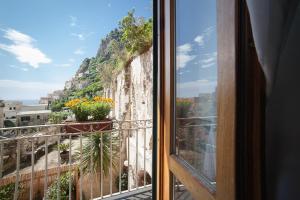 a balcony with a view of a mountain at Hotel L'Argine Fiorito in Atrani