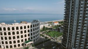 an aerial view of a building and the ocean at Silk Road Batumi in Batumi