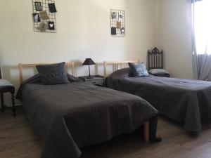 Postel nebo postele na pokoji v ubytování Casa Caminhos + 27 fotografií