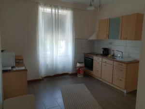 a kitchen with a window and a sink and a stove at Waldshut-Zentrum in Waldshut-Tiengen