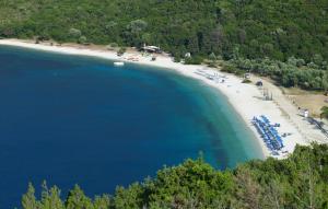 an aerial view of a beach with blue water at Muses Studios Sami in Sami