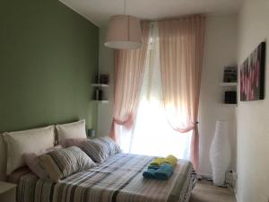 Ένα ή περισσότερα κρεβάτια σε δωμάτιο στο CittadellaChiara