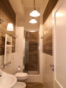 a bathroom with a shower and a toilet and a sink at Urbana 33 in Rome +37 photos