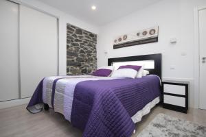 Giường trong phòng chung tại Villa Por do Sol +35 ảnh