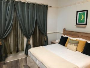 Postel nebo postele na pokoji v ubytování Hotel San Ramon