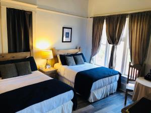Postel nebo postele na pokoji v ubytování Hotel San Ramon