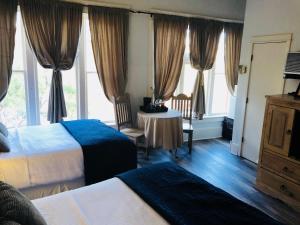 Postel nebo postele na pokoji v ubytování Hotel San Ramon