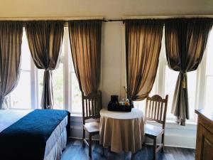 Postel nebo postele na pokoji v ubytování Hotel San Ramon