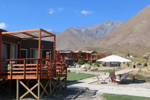 a cabin with a view of the mountains at Cabañas Kakanchik in Vicuña