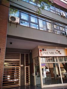 a building with the front entrance of aprogramunit at Apartamentos Mendoza in Mendoza