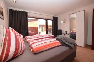 Кровать или кровати в номере Kingfisher-Ferienhaus
