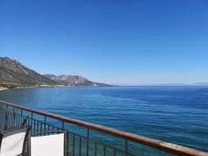 a view of the ocean from a balcony at romanza rooms in Poulithra