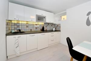 Kuchyňa alebo kuchynka v ubytovaní Pure Apartman Pécs