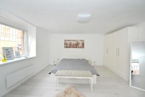 Posteľ alebo postele v izbe v ubytovaní Pure Apartman Pécs
